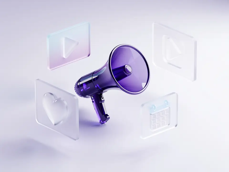 A purple glass megaphone among floating photo, video, heart and calendar cards